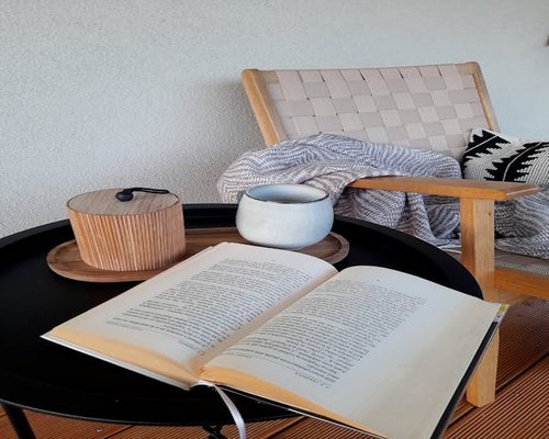 Cozy reading corner with an armchair and a book